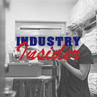 Young maid preparing for housekeeping work in a hotel.